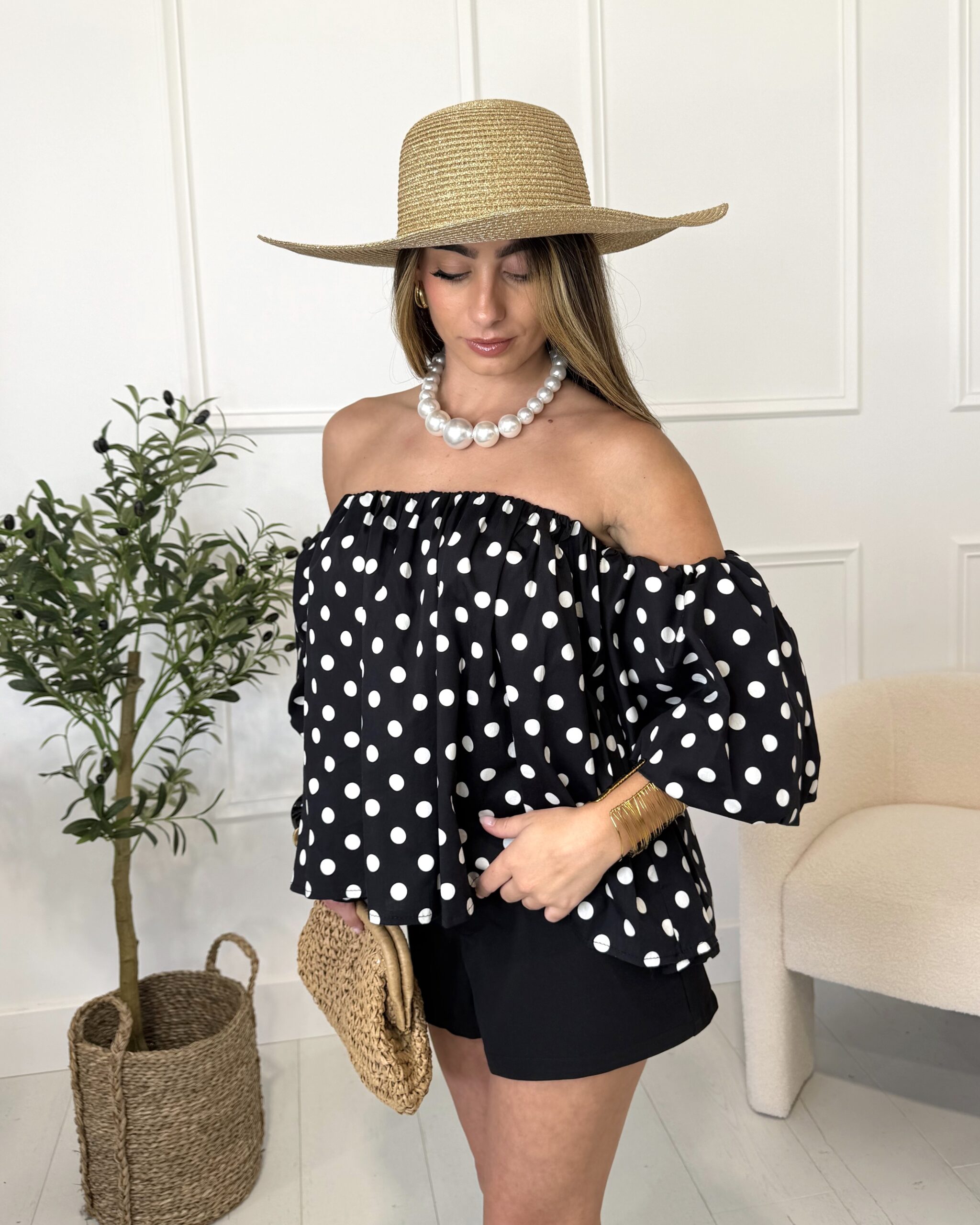 Top bustier sans bretelles à manches bouffantes noir à pois